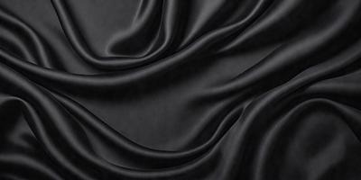 The primary subject of the image is a black fabric, which appears to be a piece of clothing or a curtain. The setting is a dark room, and the visual style is a close-up of the fabric. The colors and mood of the image are predominantly dark and moody, with the black fabric being the main focus.