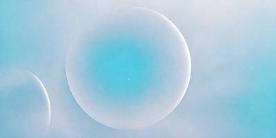 The primary subject of the image is a large, round, blue object, which appears to be a sphere or a dome. The setting is a cloudy sky, and the visual style is a combination of a photo and a drawing. The colors and mood of the image are predominantly blue, creating a calm and serene atmosphere.