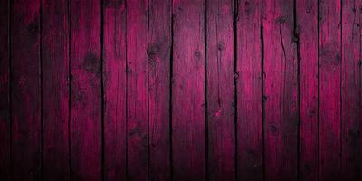The primary subject of the image is a wooden surface, possibly a wall or a table, with a purple color. The setting appears to be a room or an outdoor space, as the wooden surface is the main focus of the image. The visual style is a close-up of the wooden surface, which gives the image a detailed and intimate feel. The dominant colors are purple and brown, creating a warm and inviting atmosphere.