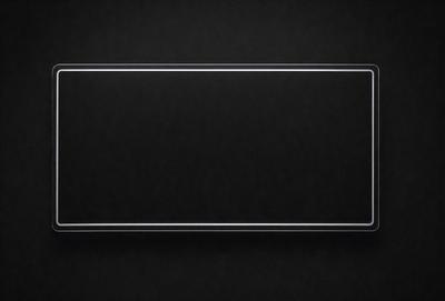 The primary subject of the image is a black background with a white square. The setting is a dark room, and the visual style is a simple, clean design. The colors and mood are predominantly dark and moody, with the white square standing out against the black background.