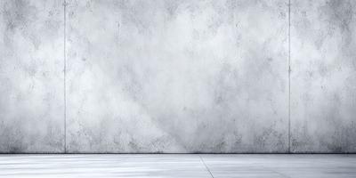 The primary subject of the image is a white wall with a grey texture. The setting is a room with a concrete floor. The visual style is a photo, and the colors and mood are predominantly white and grey, giving the scene a clean and minimalist appearance.