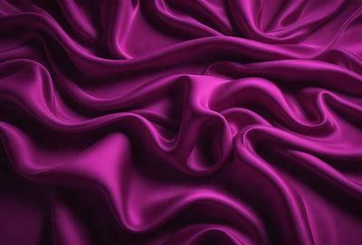 The primary subject of the image is a purple fabric, which is the main object, scene, or focus of the image. The setting/background consists of a purple curtain, and the visual style is a close-up of the purple fabric. The colors and mood of the image are predominantly purple, creating a calm and soothing atmosphere.