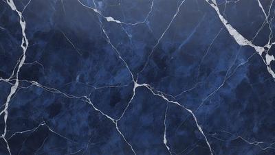 The primary subject of the image is a blue marble wall with a pattern of white and blue veins. The setting is a room with a blue marble floor. The visual style is a close-up of the marble wall, showcasing the intricate vein patterns. The colors and mood of the image are predominantly blue, creating a calm and serene atmosphere.