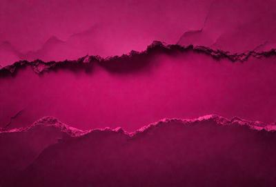 The primary subject of the image is a pink wall with a large crack in it. The setting is a room with a pink background. The visual style is a close-up of the pink wall with a crack. The colors and mood of the image are predominantly pink, giving it a warm and inviting atmosphere.