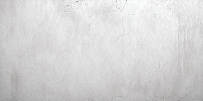 The primary subject of the image is a white wall with a rough texture. The setting is a room with a concrete surface. The visual style is a photo, and the colors and mood are predominantly white, giving the image a clean and minimalist appearance.