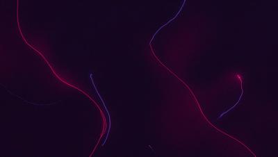 The primary subject of the image is a purple background with a series of red lines or streaks. The setting appears to be a dark room, and the visual style is a combination of digital art and illustration. The dominant colors are purple and red, creating a moody and dramatic atmosphere.