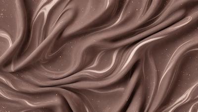 The primary subject of the image is a brown fabric, possibly a piece of clothing or a curtain. The setting is a close-up of the fabric, showcasing its texture and pattern. The visual style is a detailed, up-close view of the fabric, which gives it a textured and intricate appearance. The colors and mood of the image are predominantly brown, creating a warm and earthy atmosphere.