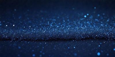 The primary subject of the image is a blue background with a pattern of glittering, sparkling, or shining blue lights. The setting appears to be a dark room, and the visual style is a close-up of the blue background. The colors and mood of the image are predominantly blue, creating a serene and calming atmosphere.
