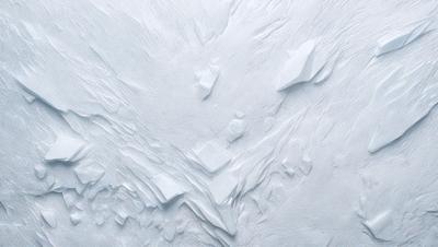The primary subject of the image is a large, white, and textured surface, possibly a wall or a piece of art. The setting appears to be a snowy mountain, with a rocky landscape and a blue sky in the background. The visual style of the image is a combination of photo and digital art, creating a unique and intriguing appearance. The colors and mood of the image are predominantly white and blue, with a sense of depth and contrast provided by the rocky landscape and the blue sky.