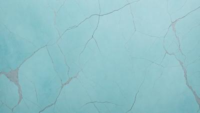 The primary subject of the image is a blue marble wall with a cracked and textured surface. The setting is a room with a blue-tinted wall, which creates a unique and visually striking atmosphere. The visual style is a close-up of the wall, showcasing its intricate texture and design. The colors and mood of the image are predominantly blue, giving it a calm and serene ambiance.