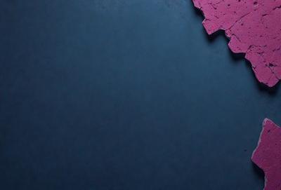 The primary subject of the image is a blue background with a pattern of pink and purple tiles. The setting appears to be a dark room, possibly a nightclub or a darkened room for a performance. The visual style of the image is a combination of a photo and a digital art, as it has a slightly blurred appearance. The dominant colors in the image are blue, pink, and purple, creating a vibrant and lively atmosphere.
