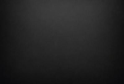 The primary subject of the image is a black background with a white dot in the center. The setting is a dark room, and the visual style is a simple, minimalist design. The colors and mood are predominantly dark and moody, with the white dot providing a contrasting element.
