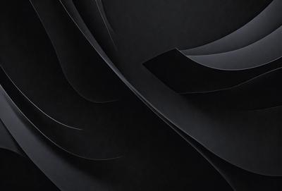 The primary subject of the image is a black and white photograph of a flower. The setting is a dark background, which emphasizes the flower's shape and texture. The visual style is a close-up of the flower, showcasing its details. The colors and mood of the image are predominantly black and white, creating a classic and timeless atmosphere.