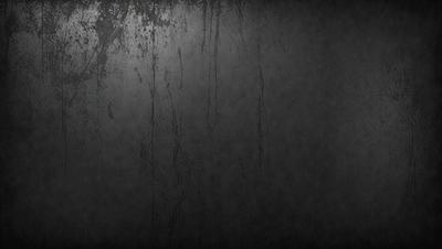 The primary subject of the image is a black background with a few white spots. The setting is a dark room, and the visual style is a black and white photo. The dominant colors are black and white, and the overall atmosphere is moody and dramatic.