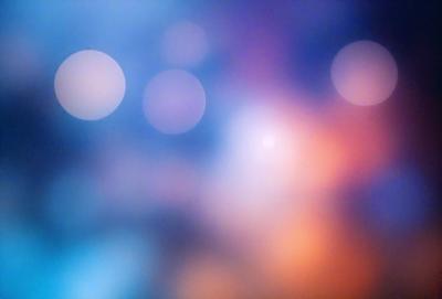 The primary subject of the image is a colorful, blurry background with a few bright lights. The setting appears to be a dark room, and the visual style is a combination of a photo and digital art. The colors and mood of the image are vibrant and energetic, with a focus on the bright lights and the overall artistic composition.