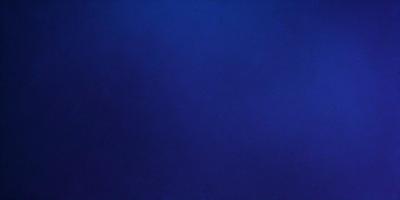 The primary subject of the image is a large, dark blue surface. The setting is a vast, open space with no visible objects or people. The visual style is a close-up of the blue surface, which gives a sense of depth and dimension. The colors and mood of the image are predominantly dark and moody, with the blue surface being the main focus.