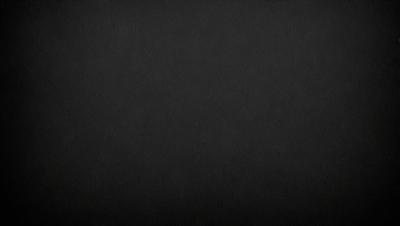 The primary subject of the image is a black background. The setting is a dark, empty space with no visible objects or elements. The visual style is a simple, monochromatic design. The colors and mood are predominantly dark and moody, creating a sense of mystery or drama.