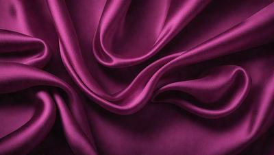The primary subject of the image is a purple fabric, which is the main object, scene, or focus of the image. The setting or background is a purple fabric, and the visual style is a photo. The colors and mood of the image are predominantly purple, creating a calm and soothing atmosphere.