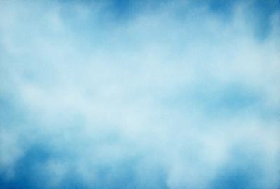 The primary subject of the image is a cloudy blue sky. The setting is a vast, open space with no visible landmarks or objects. The visual style is a natural, outdoor scene with a focus on the sky. The colors and mood are predominantly blue and serene, creating a peaceful and tranquil atmosphere.