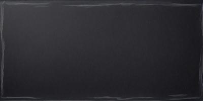 The primary subject of the image is a black background. The setting is a dark room, and the visual style is a black and white photo. The colors and mood of the image are predominantly dark and moody.