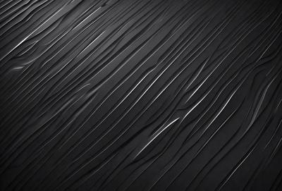 The primary subject of the image is a black and white pattern, which appears to be a textured surface or a patterned wall. The setting is a black background, which contrasts with the patterned surface. The visual style of the image is a close-up of the pattern, showcasing its intricate details. The colors and mood of the image are predominantly black and white, giving it a classic and timeless feel.