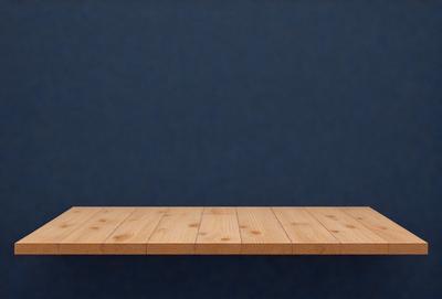 The primary subject of the image is a wooden table. The table is placed on a blue surface, which could be a tablecloth or a wall. The visual style of the image is a photo, and the dominant colors are blue and brown. The overall atmosphere of the image is calm and serene.
