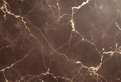 The image features a marble-like surface with a brown and white color scheme. The surface appears to be a combination of marble and cement, giving it a unique and textured appearance. The primary subject of the image is the marble-like surface, which serves as the main focus of the image. The setting is indoors, with the surface being the main background element. The visual style of the image is a close-up of the marble-like surface, showcasing its intricate details and textures.