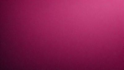 The primary subject of the image is a large, pink wall. The setting is a room with a pink background, and the visual style is a close-up of the wall. The dominant colors in the image are pink, and the overall atmosphere is warm and inviting.