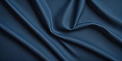 The primary subject of the image is a blue fabric, which appears to be a piece of cloth or a curtain. The setting is a dark room, and the visual style is a close-up of the fabric. The colors and mood of the image are predominantly dark and moody, with the blue fabric being the main focus.