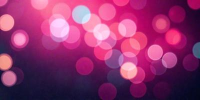The primary subject of the image is a brightly colored, pink background with a pattern of white dots. The setting appears to be a dark room, with the pink background illuminating the space. The visual style of the image is a combination of a photo and digital art, creating a unique and eye-catching effect. The dominant colors in the image are pink and white, with the pink background providing a warm and inviting atmosphere.