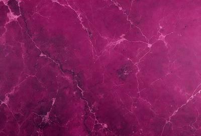 The primary subject of the image is a purple marble wall. The setting is a room with a purple marble wall as the main focus. The visual style is a close-up of the marble wall, showcasing its texture and color. The colors and mood of the image are predominantly purple, creating a calm and elegant atmosphere.