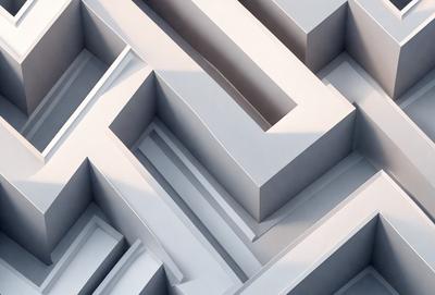 The primary subject of the image is a white, three-dimensional maze. The setting is a white background, which provides a clean and minimalistic appearance. The visual style is a digital art or illustration, as the maze is depicted in a detailed and intricate manner. The colors and mood of the image are predominantly white, giving it a clean and simple appearance.