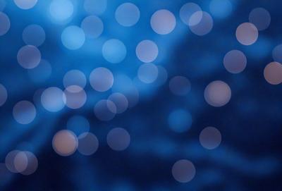 The primary subject of the image is a blue sky filled with bright, white, and blue lights. The setting is a night sky, and the visual style is a photo. The colors and mood of the image are predominantly blue and serene, creating a peaceful and tranquil atmosphere.