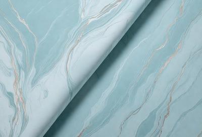 The primary subject of the image is a blue marble wallpaper with a pattern of swirls. The setting is a room with a blue wall, and the visual style is a close-up of the wallpaper. The colors and mood of the image are predominantly blue, creating a calm and serene atmosphere.