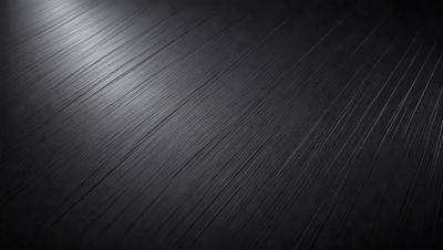 The primary subject of the image is a black background with a pattern of black and white stripes. The setting is a dark room, and the visual style is a close-up of the black and white stripes. The colors and mood of the image are predominantly dark and moody, with the black and white stripes creating a sense of depth and contrast.