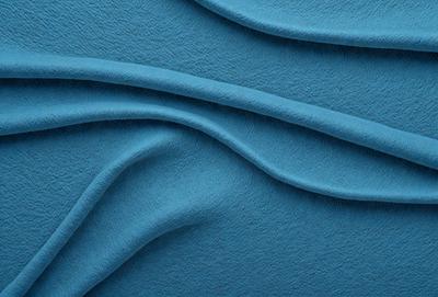 The primary subject of the image is a blue fabric with a wavy pattern. The setting is a blue background, and the visual style appears to be a digital art or illustration. The dominant colors are blue and white, creating a calm and soothing atmosphere.