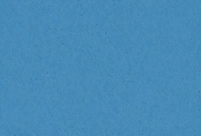 The primary subject of the image is a blue background with a pattern of white dots. The setting is a clear blue sky, and the visual style is a close-up of the blue background. The colors and mood of the image are predominantly blue and calm, creating a serene atmosphere.