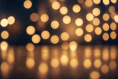 The primary subject of the image is a close-up of a light source, possibly a light bulb or a string of lights, with a yellowish hue. The setting is a dark room, and the visual style appears to be a photo or a digital artwork. The colors and mood of the image are warm and inviting, creating a cozy and intimate atmosphere.