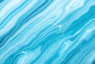 The primary subject of the image is a blue and white marble-like pattern. The setting is a blue and white marble-like surface, which could be a wall or a countertop. The visual style is a close-up of the marble-like pattern, showcasing its intricate details. The colors and mood of the image are predominantly blue and white, creating a calm and serene atmosphere.