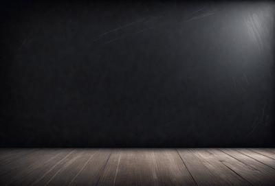 The primary subject of the image is a black background with a light source shining on it. The setting is a dark room, and the visual style is a black and white photo. The colors and mood of the image are predominantly dark and moody, with the light source creating a contrasting effect.