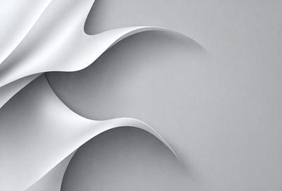 The primary subject of the image is a white paper with a pattern of folded edges. The paper is displayed on a gray background, giving it a clean and minimalist appearance. The visual style of the image is a close-up of the paper, showcasing its intricate folded edges. The colors and mood of the image are predominantly white and gray, creating a calm and serene atmosphere.
