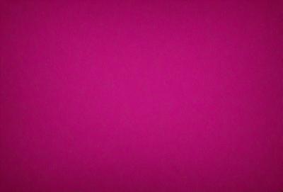 The primary subject of the image is a large, pink surface. The setting is a dark background, which contrasts with the bright pink color of the surface. The visual style appears to be a close-up of the pink surface, possibly a photo or a digital art piece. The colors and mood of the image are predominantly pink, creating a warm and vibrant atmosphere.
