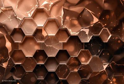 The primary subject of the image is a close-up of a copper-colored honeycomb pattern. The setting is a dark background, which contrasts with the honeycomb pattern. The visual style is a close-up of the honeycomb pattern, which gives a sense of depth and texture. The colors and mood of the image are predominantly dark, with the copper honeycomb pattern being the main focus and source of visual interest.