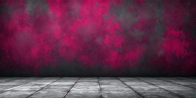 The primary subject of the image is a red wall with a pinkish hue. The setting is a room with a black background, which contrasts with the red wall. The visual style is a photo, capturing the red wall and its surroundings. The dominant colors are red and pink, creating a warm and vibrant atmosphere.