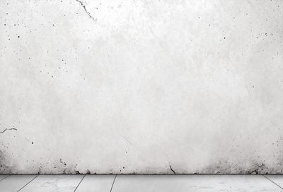 The primary subject of the image is a white wall with a dirty texture. The setting is a room with a wooden floor. The visual style is a photo, and the colors and mood are predominantly white, giving the image a somewhat dull and aged appearance.