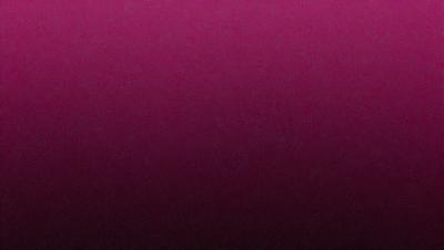 The primary subject of the image is a close-up of a purple wall. The setting is a room with a purple wall, and the visual style is a photo. The dominant colors in the image are purple, and the overall atmosphere is calm and serene.