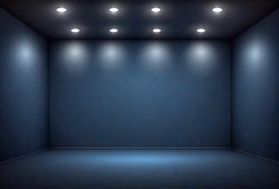 The primary subject of the image is a large, empty room with a blue wall. The setting is a dark room with a blue background, and the visual style is a black and white photo. The colors and mood of the image are predominantly dark and moody, with the blue wall and the overall atmosphere creating a sense of emptiness and solitude.