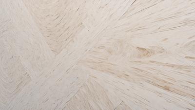 The primary subject of the image is a wooden floor with a unique pattern. The setting is a room with a wooden floor, and the visual style appears to be a photo. The colors and mood of the image are predominantly brown, giving it a warm and natural atmosphere.