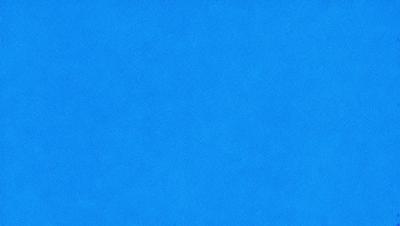 The primary subject of the image is a large, blue surface. The setting is a clear, blue sky, and the visual style is a photo. The colors and mood of the image are predominantly blue, creating a calm and serene atmosphere.