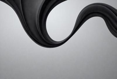 The primary subject of the image is a black and white photo of a curved, flowing line. The setting is a white background, which provides a clean and minimalist appearance. The visual style is a black and white photo, giving it a classic and timeless feel. The colors and mood of the image are predominantly black and white, creating a sense of elegance and sophistication.